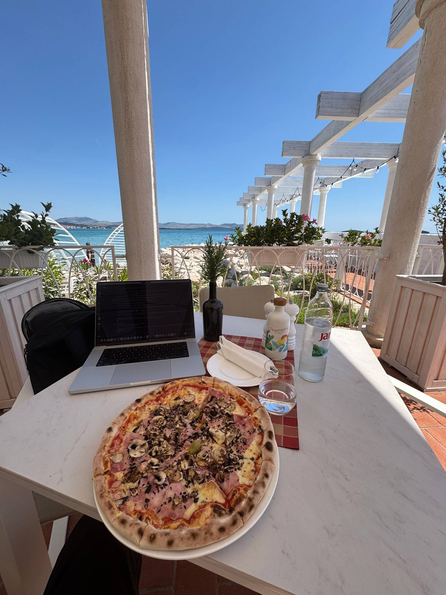 eating pizza with a beautiful view after SaaStanak